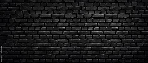 Texture Of A Perfect Black Brick Wall As Background Or Wallpaper Stock