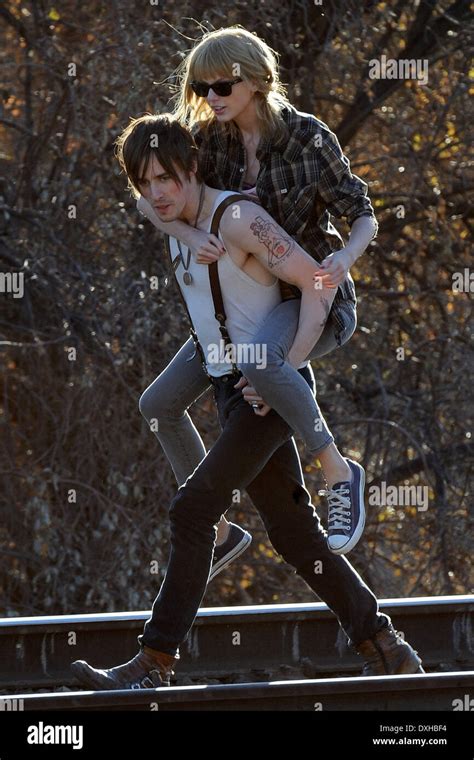 Singer Taylor Swift Gets A Piggy Back Ride By Co Star Reeve Carney On