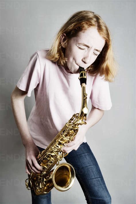 Girl Playing Saxophone Stock Photo