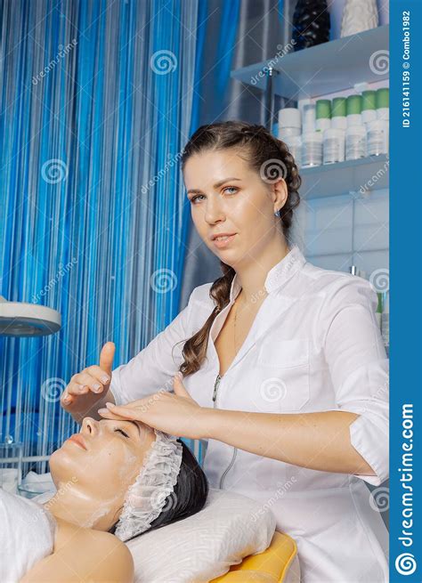 Professional Beautician Makes A Facial Massage To A Woman Stock Image Image Of Person Clean