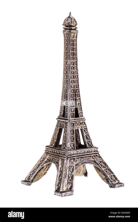 A Small Eiffel Tower Reproduction Isolated Over A White Background