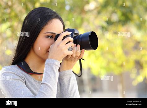 Photograph Woman Learning Photography In A Park Happy With A Green