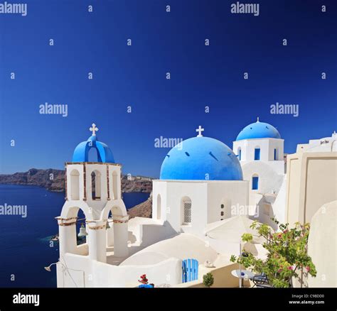 View Of Blue Dome Church In Oia Village On Santorini Island Stock Photo