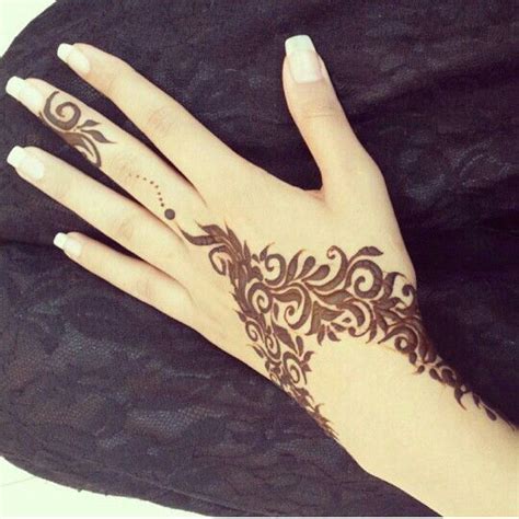 Picture Of Beautiful Henna Patterns On The Hand And Wrist