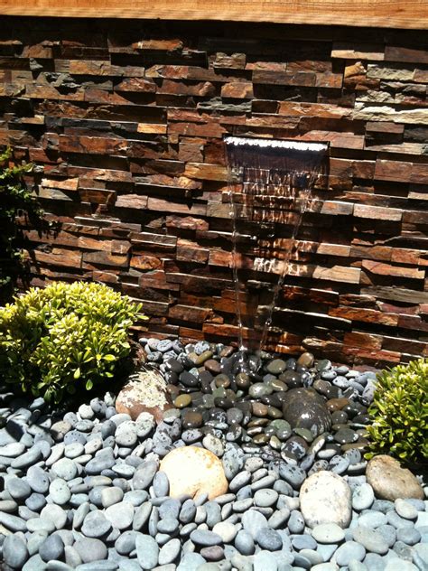 Lots of patio & garden items to choose from. San Francisco - Clean, simple fountain. River rocks ...