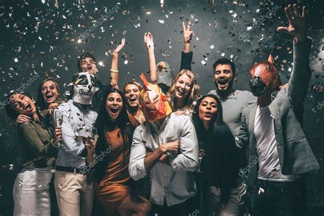 People Dancing At Party With Confetti Stock Photo By ©gstockstudio