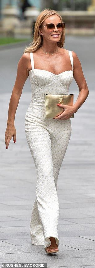 Amanda Holden Looks Sensational In Corseted White Flared Jumpsuit