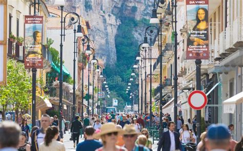 Crowd Of Tourists Walk Along Corso Italia Main Shopping Street Of