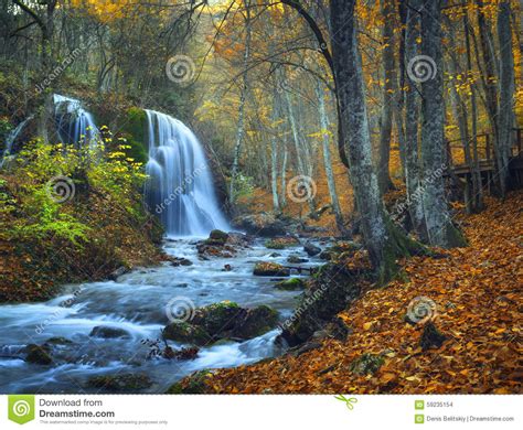 Beautiful Waterfall In Autumn Forest In Crimean Mountains At Sun Stock