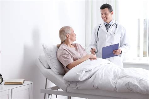 Doctor Visiting His Patient In Hospital Stock Image Image Of Mature