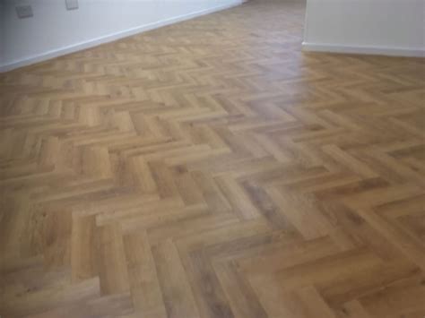 Mid Light Oak Wood Effect Flooring Laid Parquet Style Home