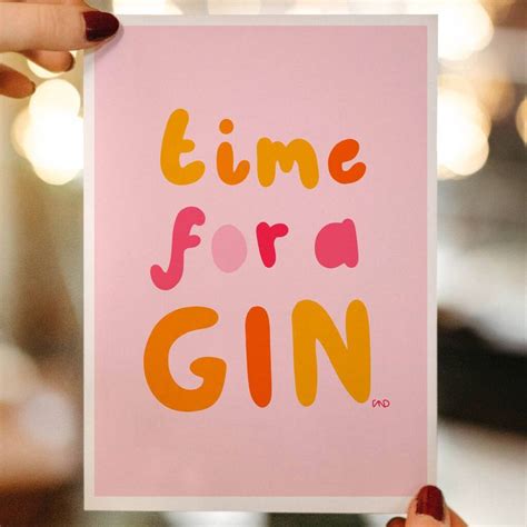 Someone Holding Up A Pink Card With The Words Time For A Gin On It