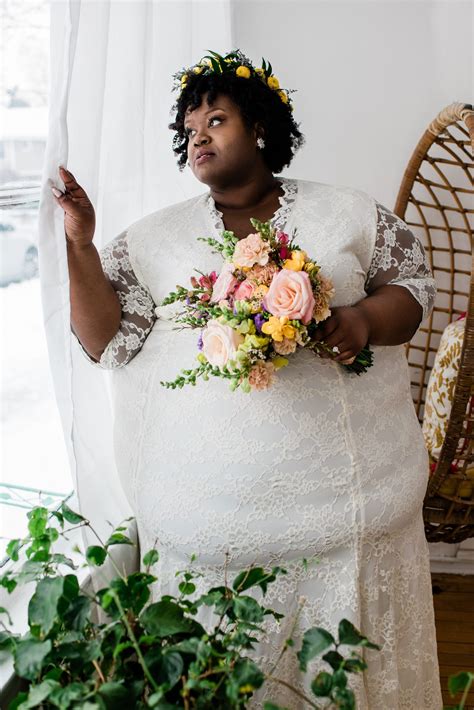 black super fat model wearing a white wedding dress unique plus size wedding dresses