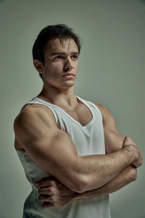 Strong Hands Sportsman Handsome Young Man With Muscular Body Posing