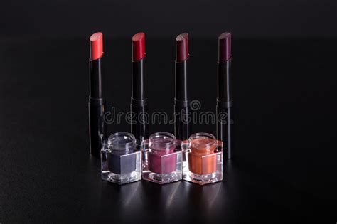 Set Of Lipsticks And Lip Glosses On Black Background Stock Photo
