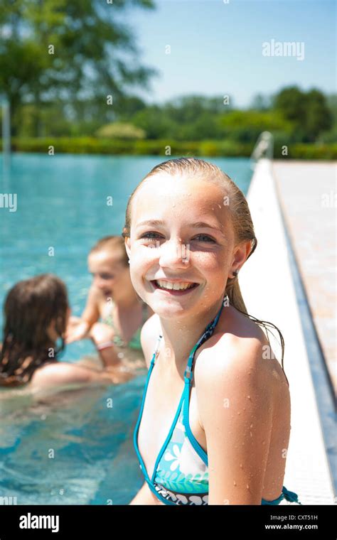 Girl On The Edge Of A Public Swimming Pool Stock Photo Alamy