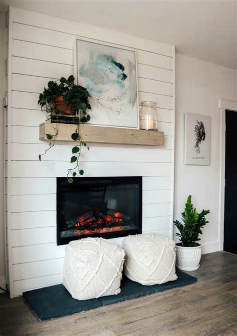 I'm veering off the path of the master bathroom remodel to bring you our diy shiplap fireplace surround makeover. Dated Rock Fireplace turned Electric Shiplap Fireplace ...