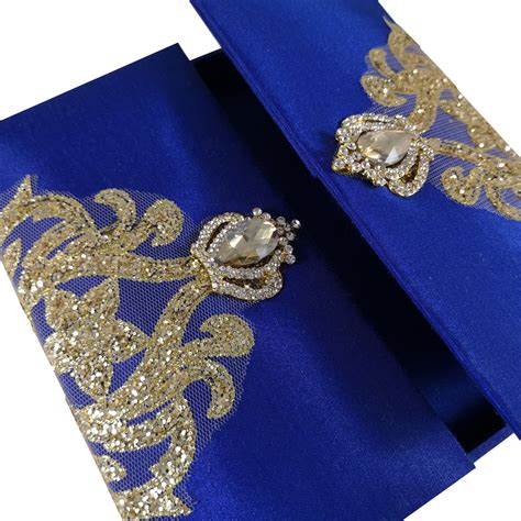 When crafting the perfect wedding invitation it is important to know the proper wedding invitation wording along with what to avoid when wording your wedding invitations. Royal Blue Glitter Invitation Box With Crown Pair Brooches