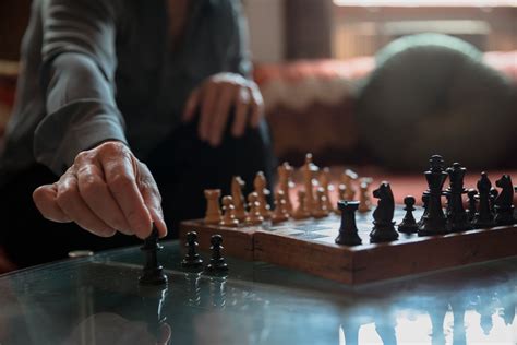 Person Playing Chess On Chess Board · Free Stock Photo
