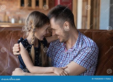 Happy Young Dad And Small Daughter Hug On Couch Stock Image Image Of
