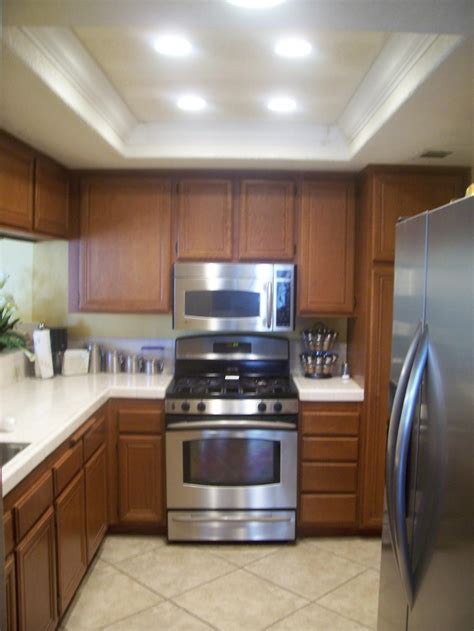 You may need one over your cooktop area. Recessed lighting layout guide kitchen