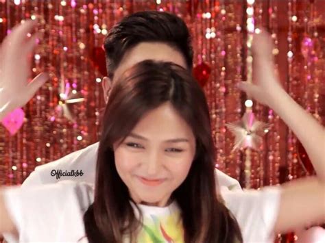 this is the pretty kathryn bernardo messing up the hair of the handsome daniel padilla during