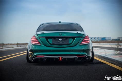The Rear End Of A Green Mercedes Cla