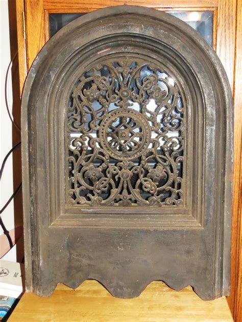 This section features heavy cast iron coat and hat hooks. Antique Decorative Cast Iron Arched Heat Wall Grate ...