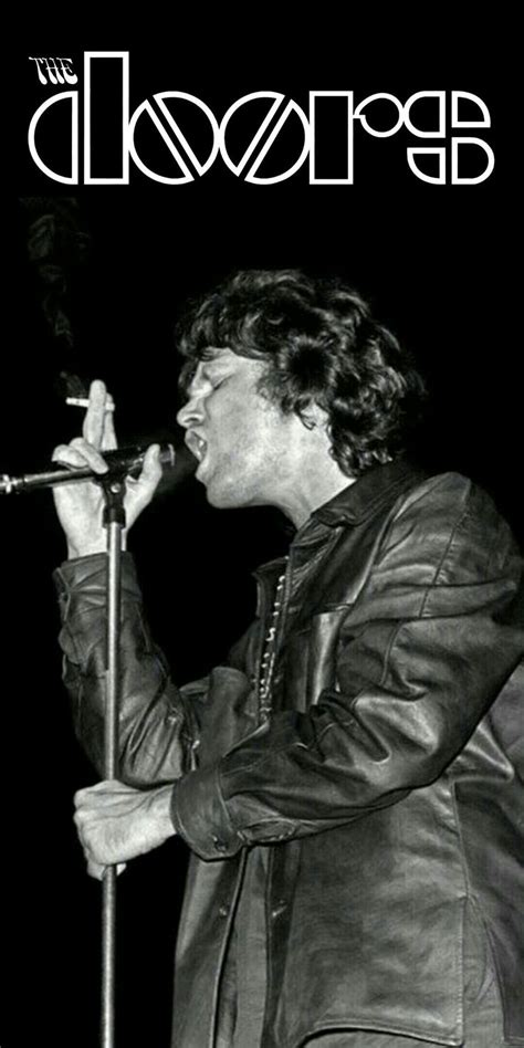 A Man Singing Into A Microphone On Top Of A Black And White Poster With The Words