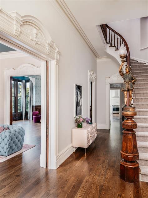 Grand Entryway Features A Spiral Staircase And Traditional Molding Hgtv