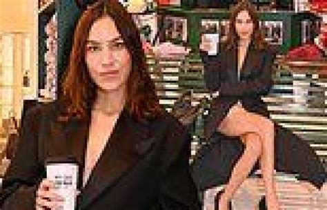 Alexa Chung Puts On A Very Leggy Display In A Chic Black Coat And Nude
