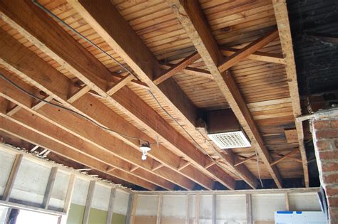 Tie the walls together 3. THE.BURK.HAUS: living room exposed floor joists mayhem