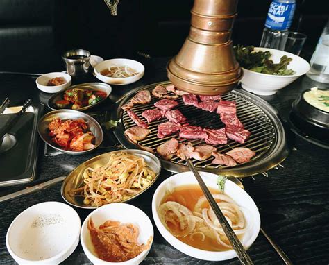 It's exciting at night, but hongdae is better. Korean BBQ - Food in seoul - The Travel Intern