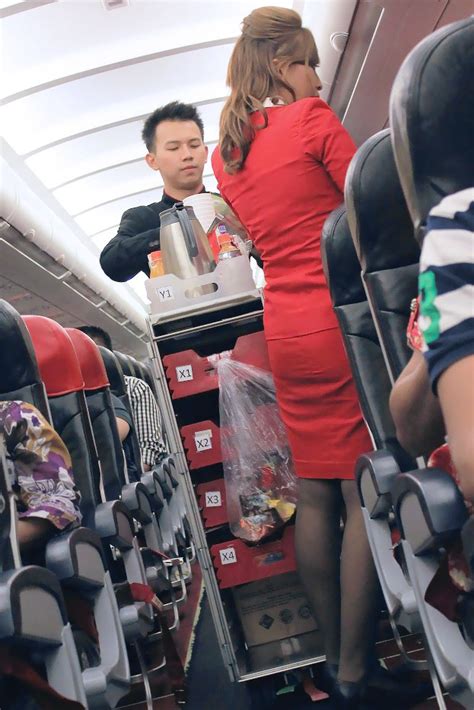 Malaysian based low cost air carrier air asia airlines represents, by far, the largest. Pretty Air Asia flight attendants in flight ~ World ...