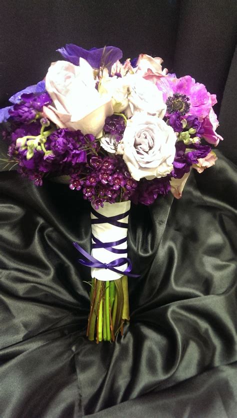Bridesmaids Bouquet With Tones Of Purple Roses Wax Flower