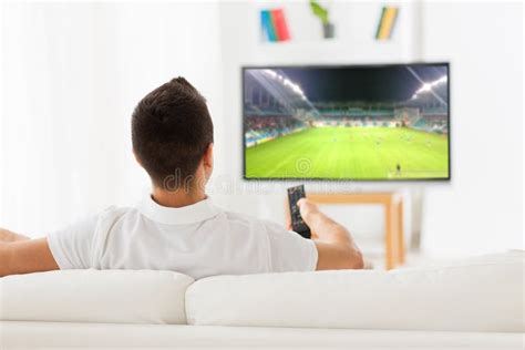Man Watching Football Or Soccer Game On Tv At Home Stock Photo Image