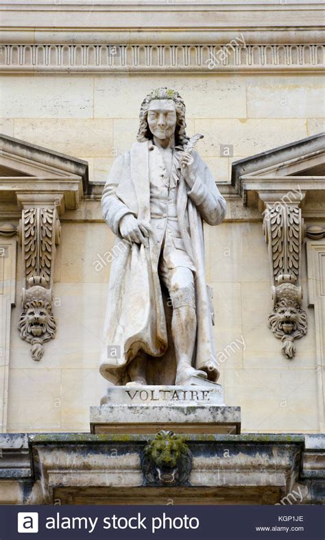 Paris France Palais Du Louvre Statue In The Cour Napoleon Voltaire
