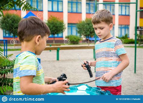 Two Boys Playing With A Spinning Top Kid Toy Popular