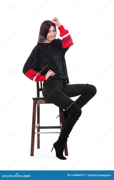 Pretty Woman In Black Suit Isolated On White Background Cute Brunette Sits On The Chair At