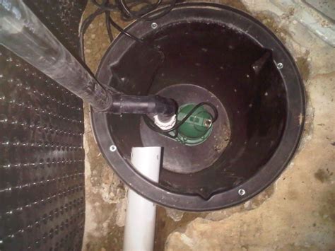 Submersible Sump Pump Installed At Bottom Of Sump Liner Concrete