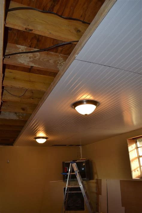 Bought 12 foot t bars for main lines through the room. Basement Ceiling Installation - no more cobwebs in my hair ...