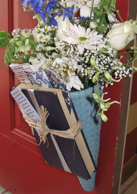 Summer bedding flowers in a wall mounted basket. This funeral arrangement was in honor of a woman whose ...