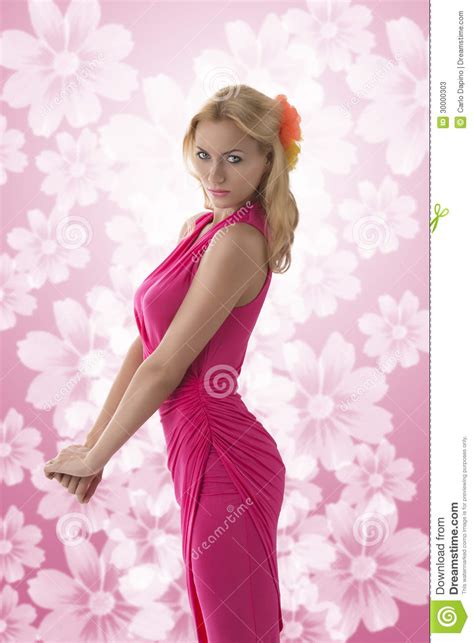 Pretty Blonde Girl With Pink Dress In Profile Stock Image