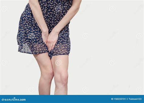 Young Woman Pressed Her Hands Between Her Legs Suffering From
