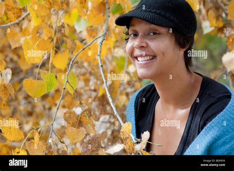 Portrait Of A Smiling Freckled Light Skinned Black Woman Stock Photo