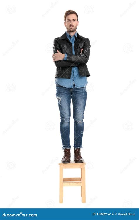 Man Standing On Chair Woman Sitting In Office Chair And Man Standing