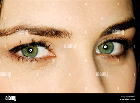 Close Up Of Female Eyes Wearing Black Eyeliner And Mascara Looking Sideways To Camera Stock