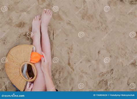 Girl Oil Spray Tanning Her Legs Protection From The Sun`s Uv Rays Putting Sunscreen Lotion