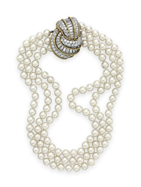 A THREE STRAND CULTURED PEARL AND DIAMOND NECKLACE Christie S