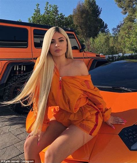 Kylie Jenner Brightens Things Up In Bold Orange Jacket As She Strikes